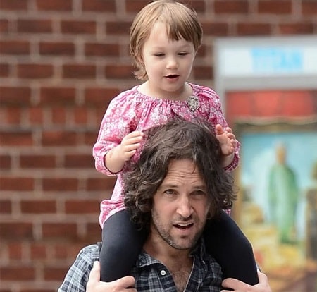 A picture of Darby Rudd on her father's shoulders.